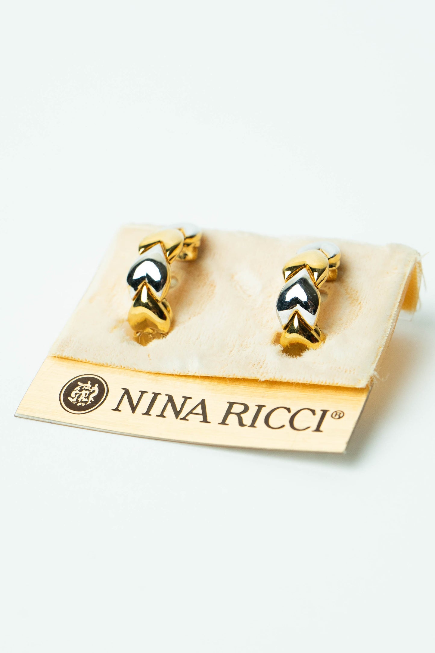 The Nina Ricci Coeurs Entrelacés Bicolores J-Hoop Earrings