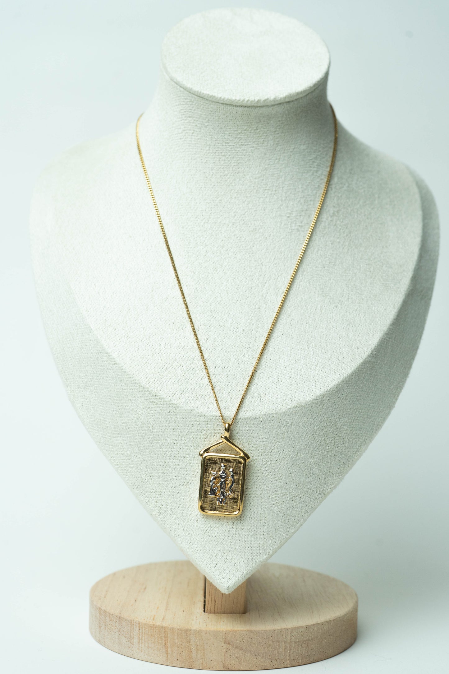 The Nina Ricci Bas-Relief Crest Pendant Necklace