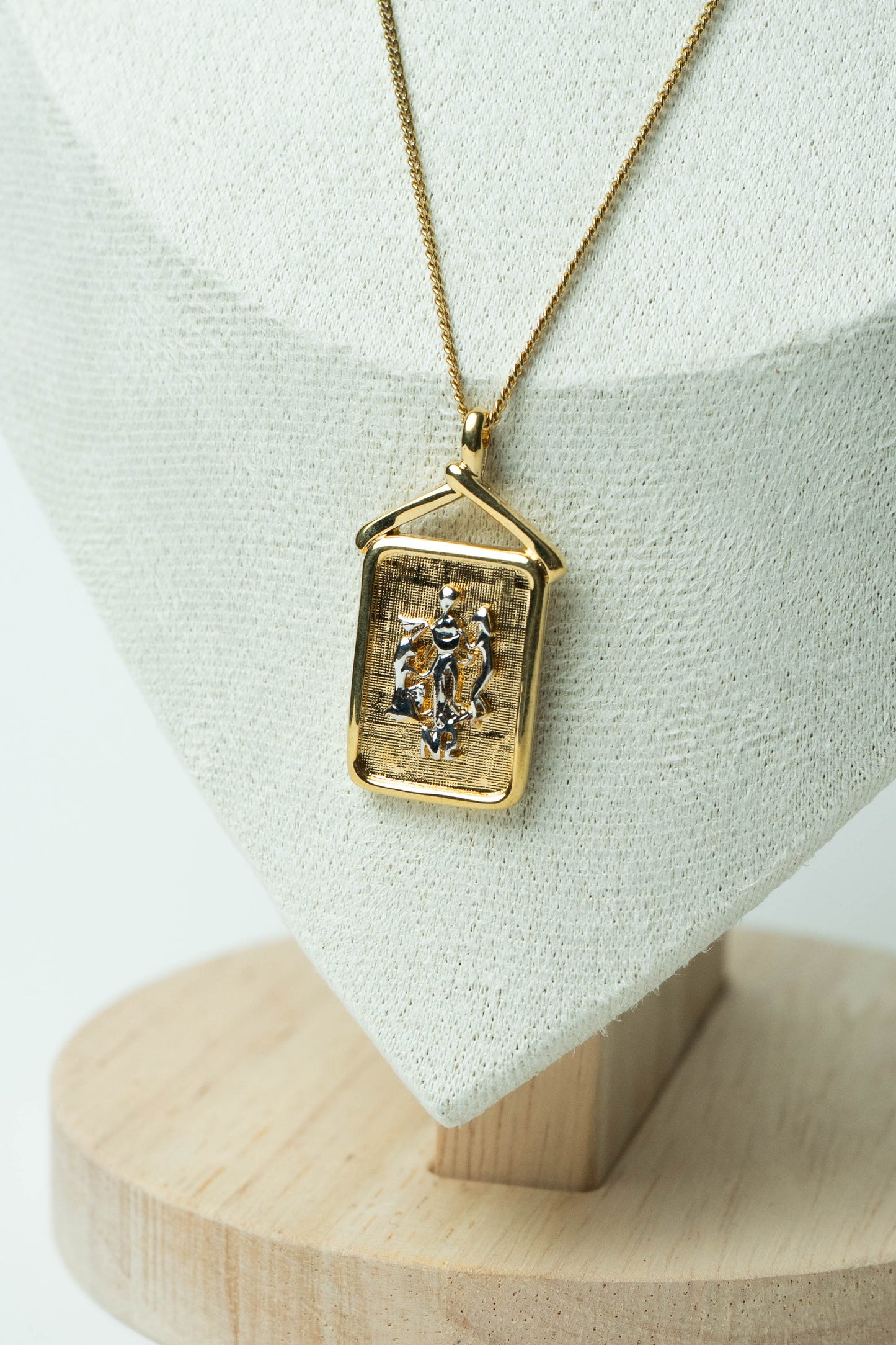 The Nina Ricci Bas-Relief Crest Pendant Necklace