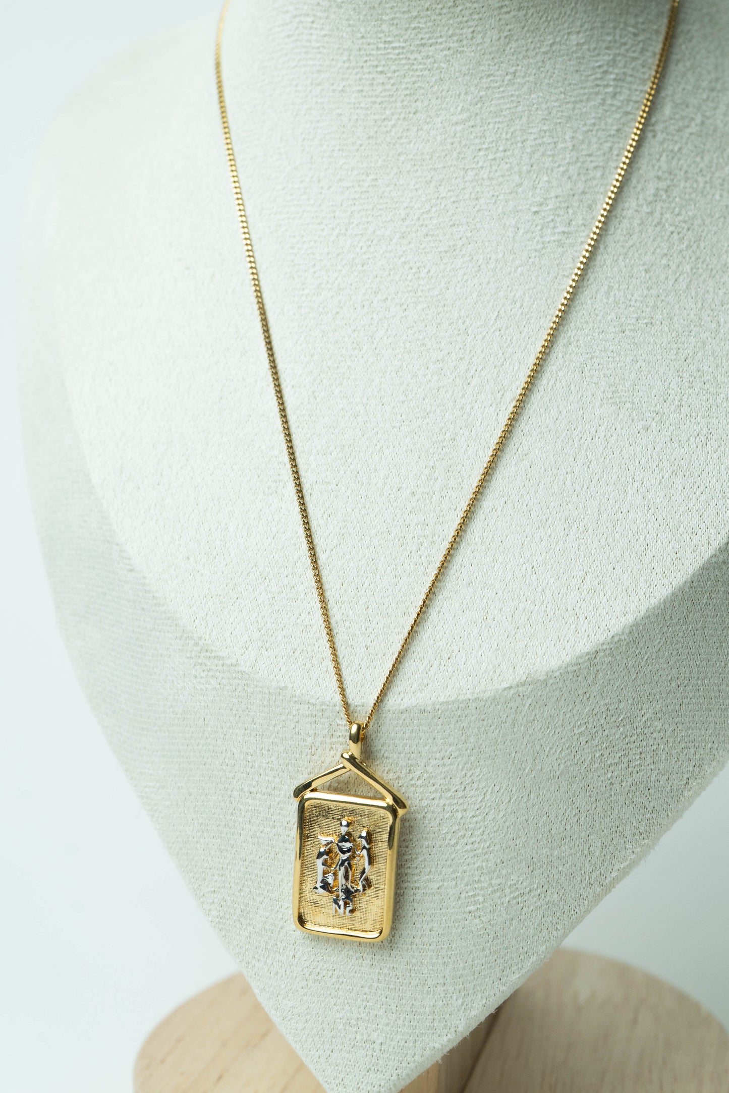 The Nina Ricci Bas-Relief Crest Pendant Necklace