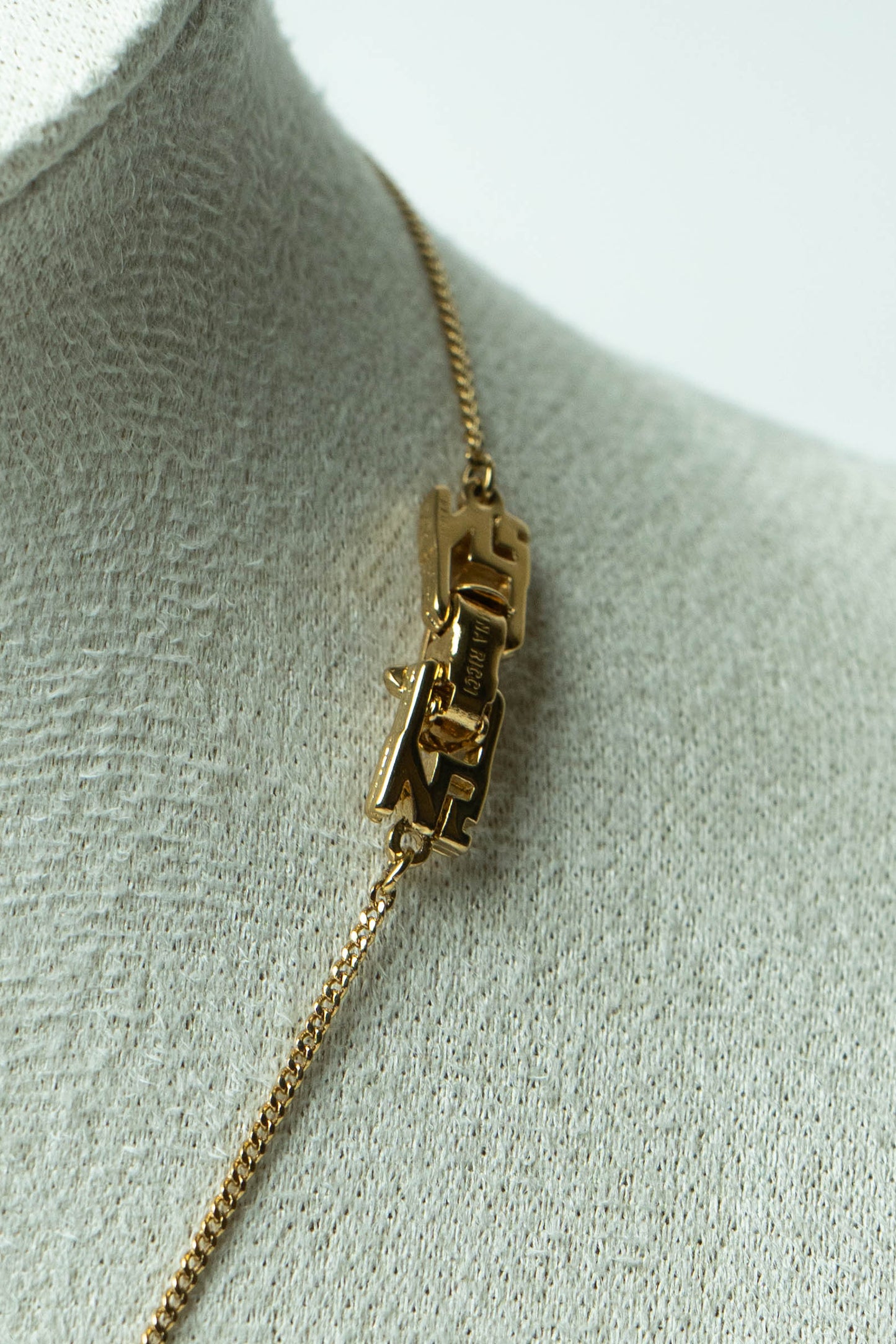 The Nina Ricci Bas-Relief Crest Pendant Necklace