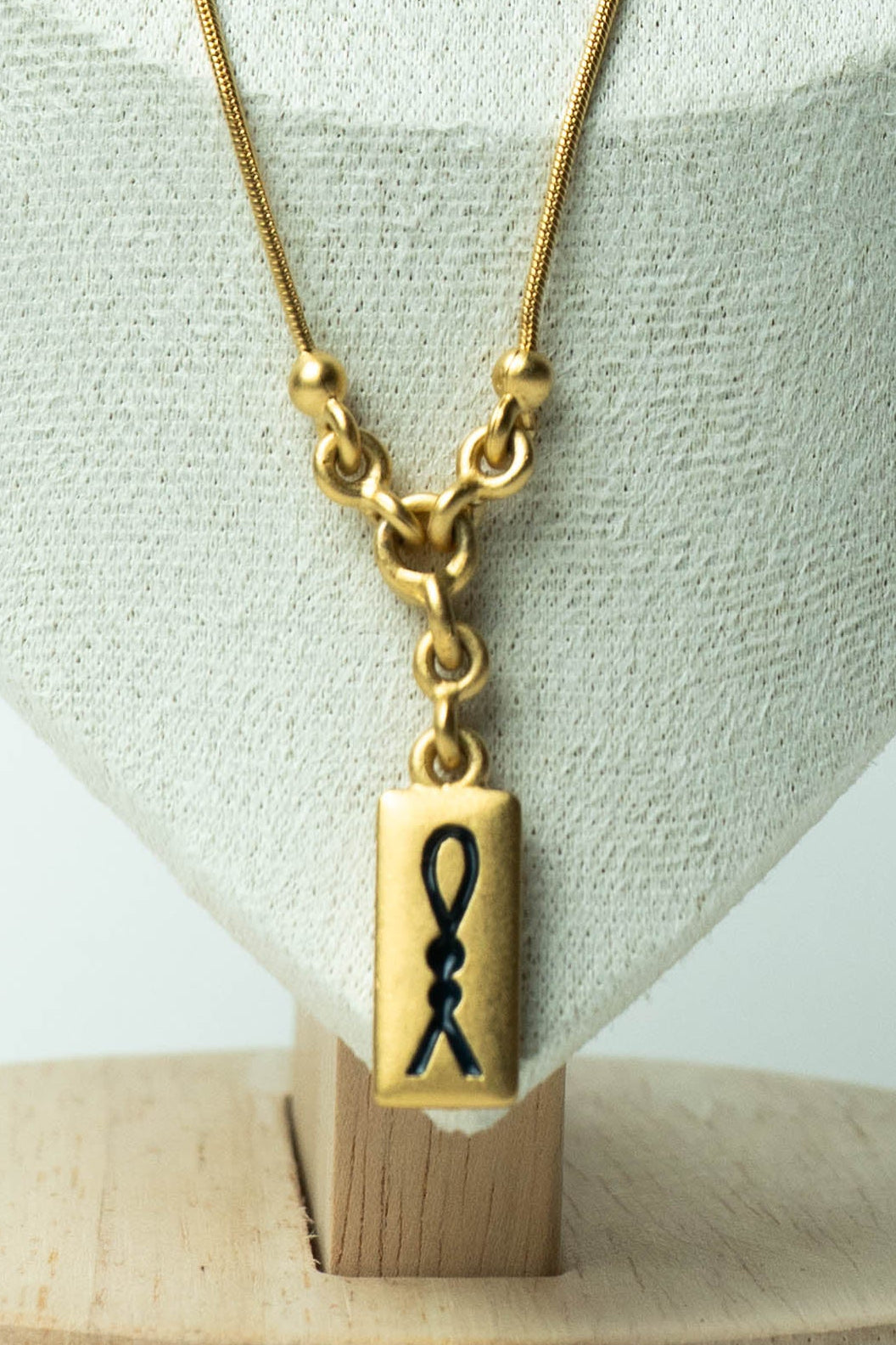 The D’Orlan Tablet Silhouette Ribbon Pendant Necklace