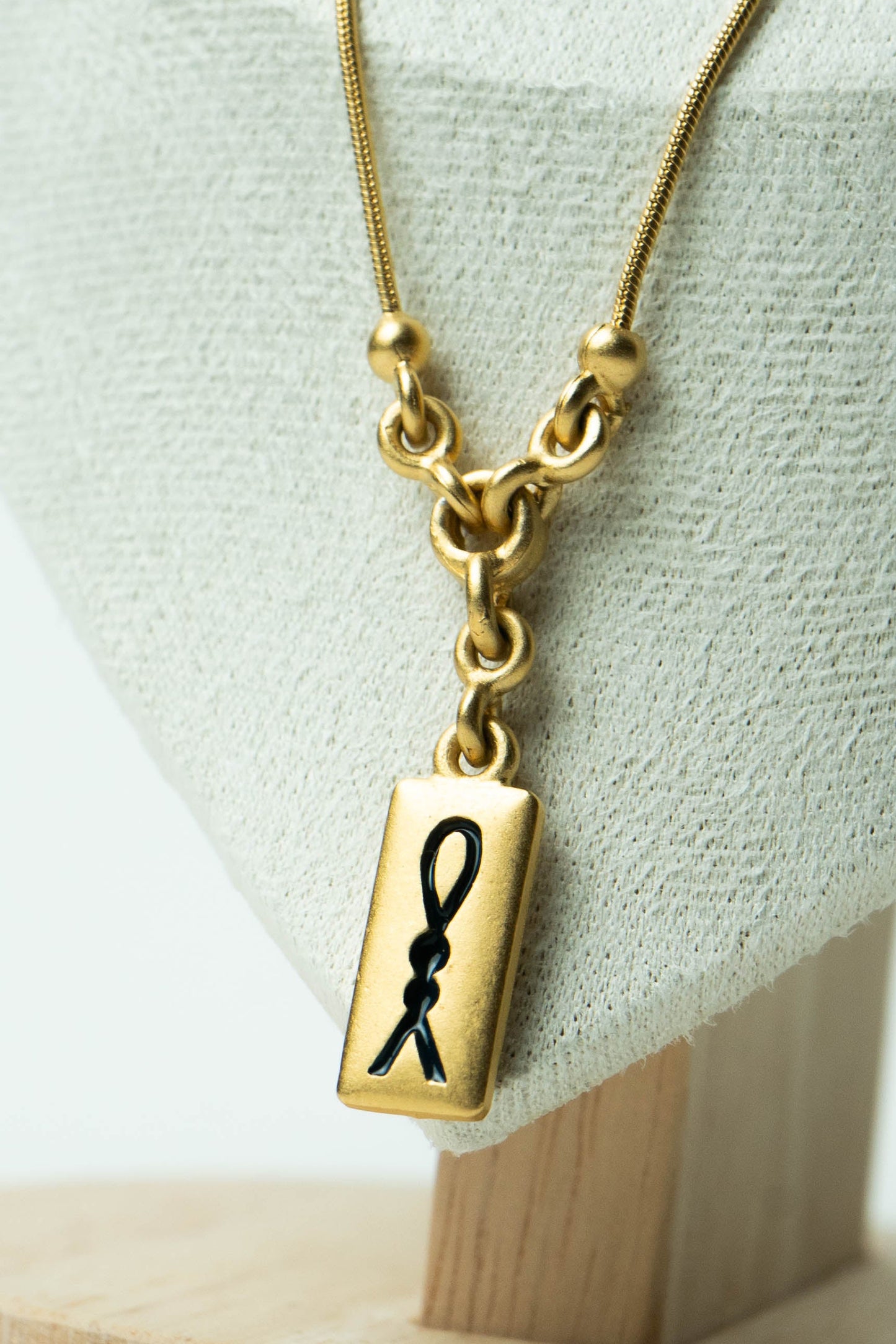 The D’Orlan Tablet Silhouette Ribbon Pendant Necklace
