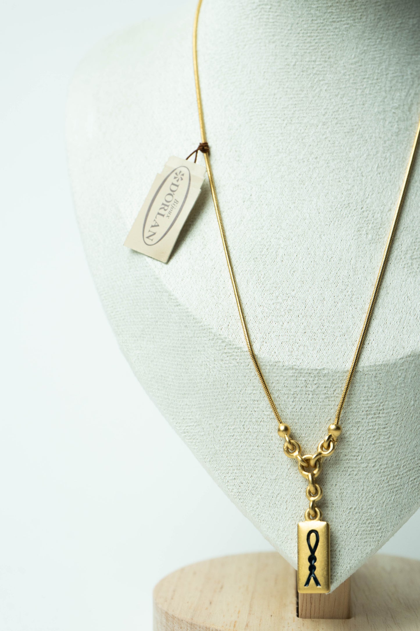 The D’Orlan Tablet Silhouette Ribbon Pendant Necklace