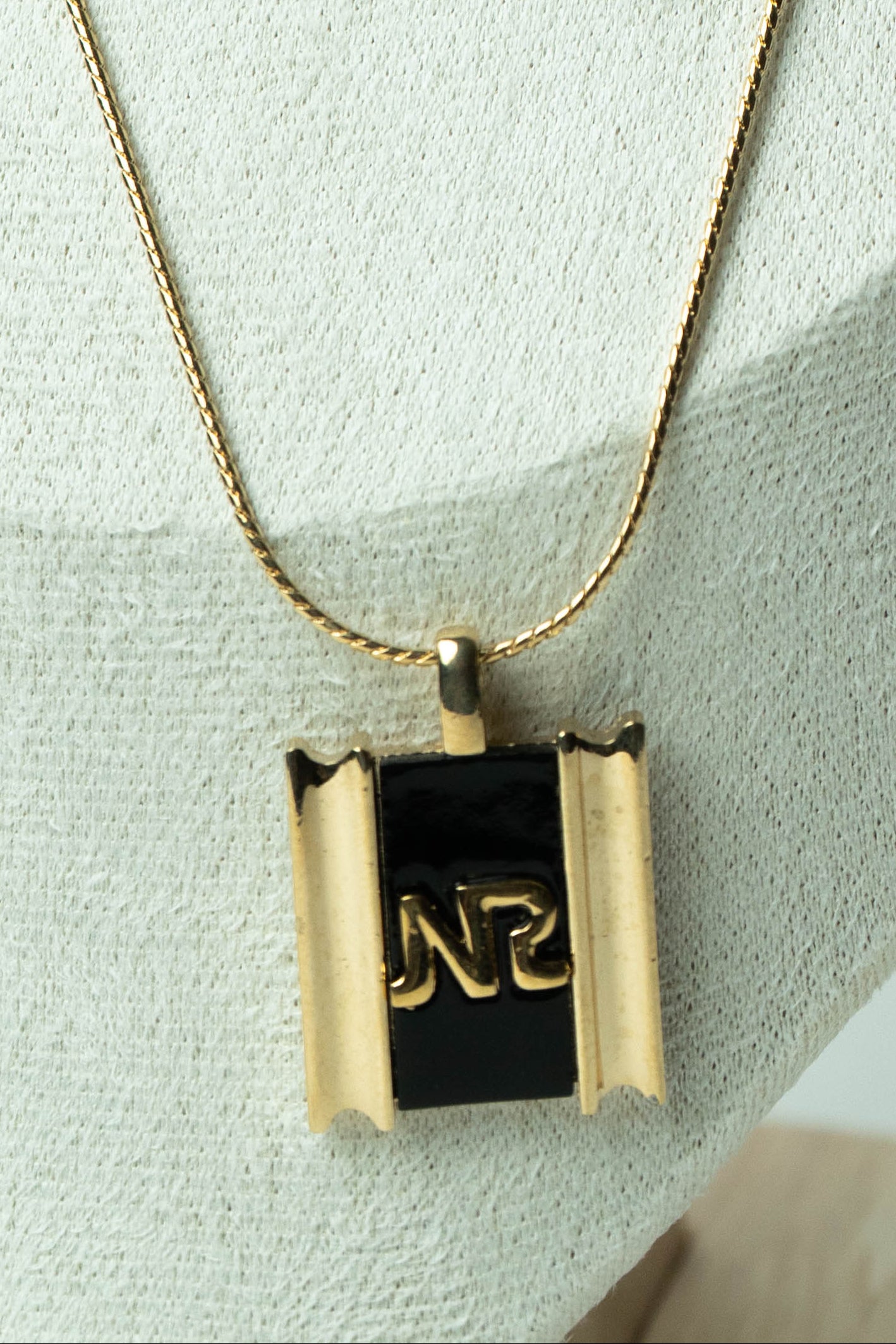 The Nina Ricci Émail Noir Monogramme Plaque Necklace